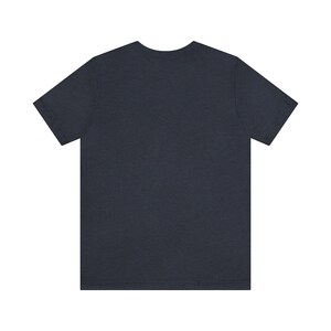 May include: A dark blue short-sleeved t-shirt.