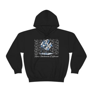 May include: Black hooded sweatshirt with a graphic of a blue and white Rubik's cube melting with the text "Rare Uncommon Different" printed below.