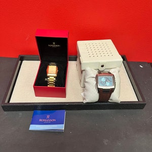 Two designer watches in boxes  — both seem to work, but need battery — sold as is — final sale — killer deal