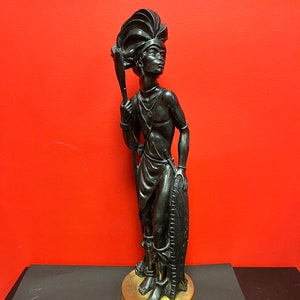 A Magnificent 25” x 7” wide vintage African spelter bronze statue of a warrior on brass base — unbelievable detail and patina. — wow