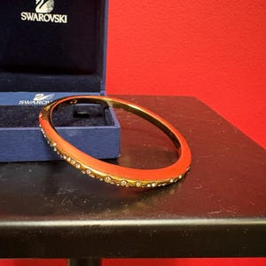 Beautiful like new 3 inch wide Swarovski bangle bracelet in original box -