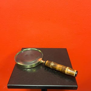 Lovely 9 inch long wood and brass magnifying glass — great condition — great gift — great price —