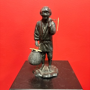 Antique Japanese bronze fisherman with bone fish — 8.5 inches tall — see photos — lovely piece — great gift