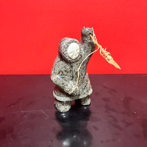 A  Fabulous 6 inch tall, authentic indigenous Inuit soapstone hunting statue with carved bone face — antique Inuit soapstone