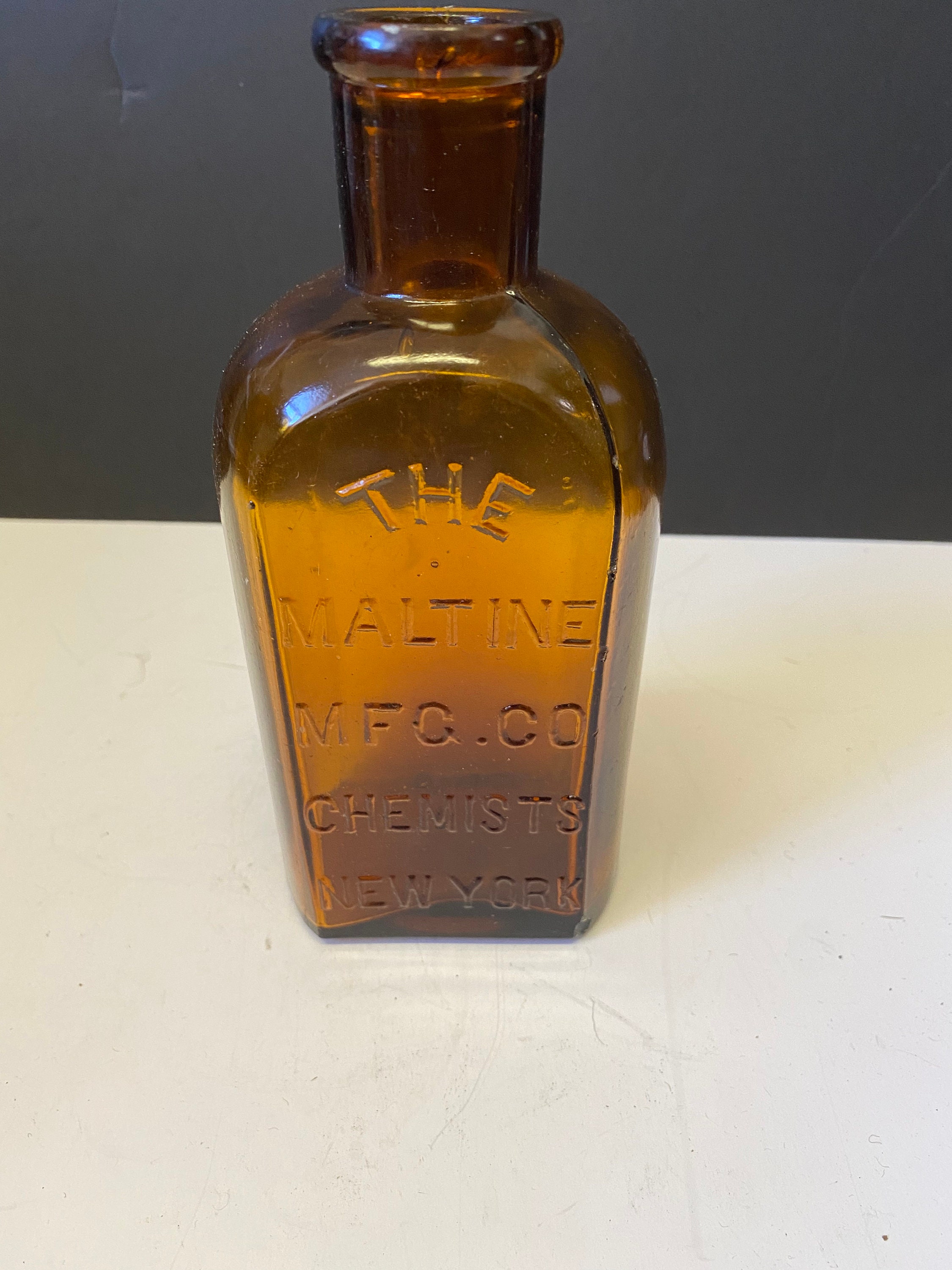 Amber necklace chemist top