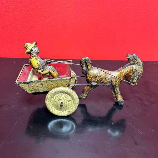 Magical antique tin man riding horse buggy — rare. — 8 inches long — good antique  condition