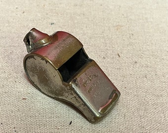 A  The acme thunderer whistle — 2 inches long in worn condition