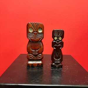 Two beautiful New Zealand Maori  statues with  abalone inset — 4.5 and 4 inches tall — sold as pair — Maori