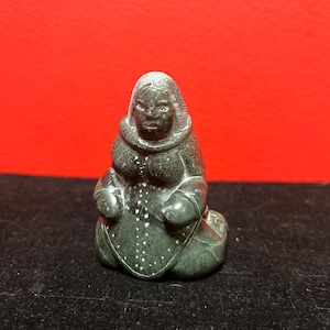 Exquisite museum quality  signed 3 inch tall antique, female artist indigenous  Inuit statue of a woman — intense quality and detail