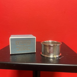Lovely antique English hallmarked napkin ring with engine turning in original box monogrammed F— 4 matching available — all mint condition
