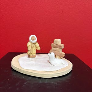 Beautiful Canadian indigenous Inuit signed clay statue of Eskimo and Inukshuk— handmade — approx 3”  high — perfect condition — great gift