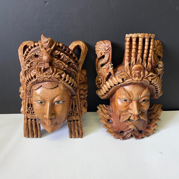 An Absolutely stunning pair of Southeast Asian 9 inch tall Carved wooden masks — great detail and bone inset teeth etc — wow condition