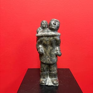 Fabulous signed indigenous Inuit  soapstone statue of a man and child  — 9 inches tall — great condition and detail — Inuit art