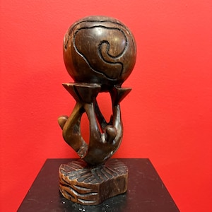 Lovely vintage African wooden statue of people holding up the world — 9 inches tall — peaceful art sculpture