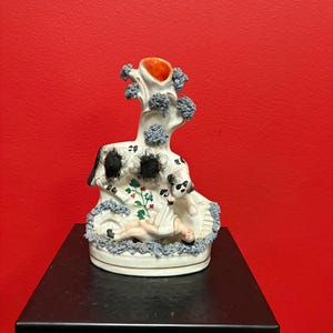 Beautiful 8  inch Staffordshire statue  of a child and dog — good condition — unusual imagery — mid 19 century -B