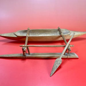 Handcrafted Wooden Outrigger Canoe Model – Maritime Heritage Decor