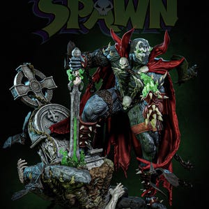 May include: A detailed Spawn action figure with a red cape, holding a sword with green energy. The figure is posed on a base with a tombstone and a chained figure. The Spawn logo is visible in the background.