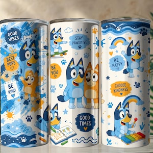 May include: A cylindrical tumbler featuring a blue and white pattern with cartoon dog characters. The design includes text such as Good Vibes, Best Pups, Be Kind, Stay Pawsitive, Be You, Good Times, Be Happy, and Choose Kindness, alongside paw prints, rainbows, and stars.