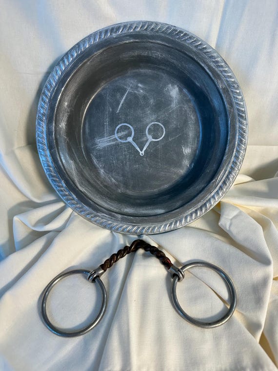 Meticulously recrafted silver bowl now showcases a breathtaking equestrian design in 2-tone gray with snaffle bit motif.