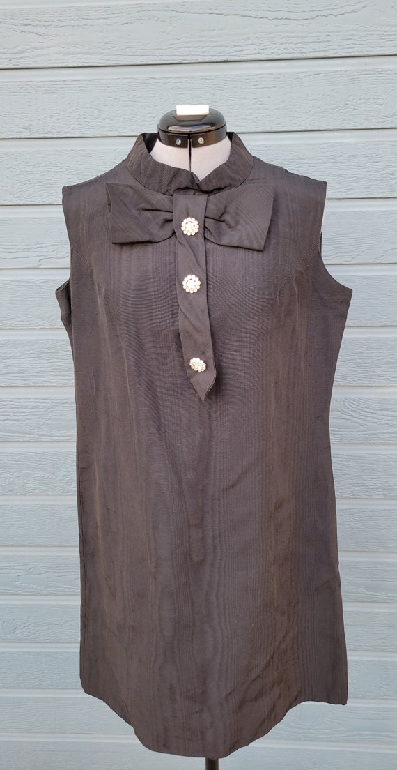 Black shift dress with buttons on front