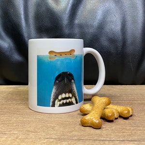 Ceramic mug…’We’re gonna need a bigger biscuit’. Fun dog lover mug. It does feature my retired greyhound Ava who ate the props!