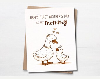 May include: A greeting card with a brown envelope features a cartoon goose and gosling. The card reads "Happy First Mother's Day as my mommy" with three small hearts above the gosling. The goose wears a pearl necklace and a bow.