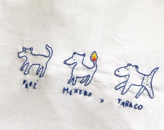 T-shirt with hand-embroidered dog design. Perfect as a gift. Original gift. Two colors and sizes available.
