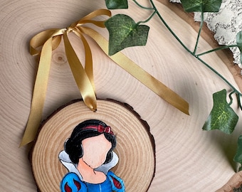 double sided, hand-painted 3-4 inch wood slice ornament with S N O Wprincess, fairest in the land princess, first princess