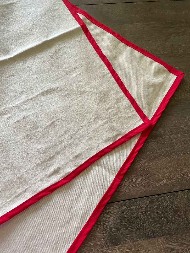 Pastry Cloth spread out on a wooden table.