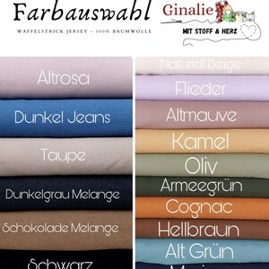 May include: A color chart of waffle knit jersey fabric in various shades, including pink, blue, beige, and brown. The text "Farbauswahl" and "Ginalie" are at the top. The fabric is 100% cotton.