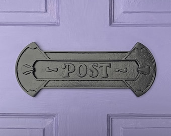 May include: Black metal mailbox with the word "POST" in raised letters.