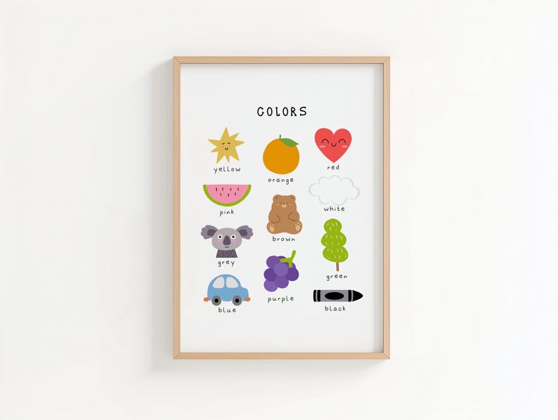 May include: A framed print titled "COLORS" features colorful illustrations of objects representing different colors. The colors include yellow, orange, red, pink, grey, blue, purple, green, white, brown, and black. The print is in a light wood frame.