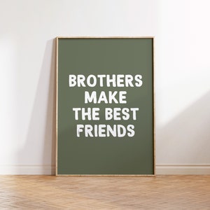 Puede incluir: Una impresión enmarcada con un fondo verde y texto blanco que dice "Brothers make the best friends".