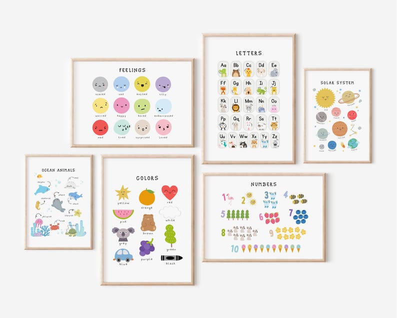 May include: A collection of framed educational prints for children. The prints feature colorful illustrations of feelings, letters, ocean animals, colors, numbers, and the solar system. Each print has a white background and is framed in a light wood.