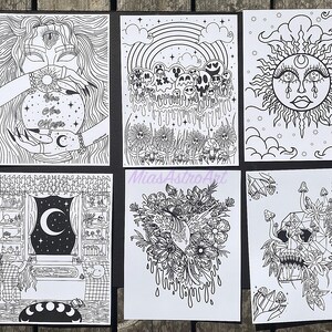 May include: Set of six black and white printable art prints featuring various mystical and occult themes. The prints include a woman holding a crystal ball, a sun with a crescent moon, a skull with flowers, a rainbow with skulls, a window with a crescent moon, and a skull with flowers and mushrooms.