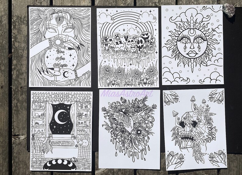 May include: Set of six black and white printable art prints featuring various mystical and occult themes. The prints include a woman holding a crystal ball, a sun with a crescent moon, a skull with flowers, a rainbow with skulls, a window with a crescent moon, and a skull with flowers and mushrooms.