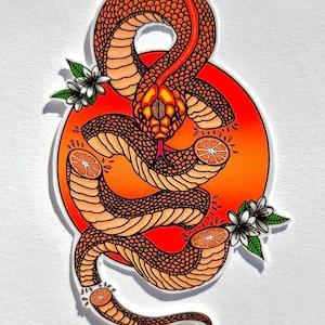 May include: A sticker featuring a stylized orange snake with a red and orange background. The snake is coiled around a circle with orange slices and white flowers.