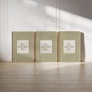 May include: A set of three rectangular wall art prints featuring a vertical olive green and white striped pattern. Each print contains a central white square with the black printed text Your Custom Quote Here in a cursive script font.