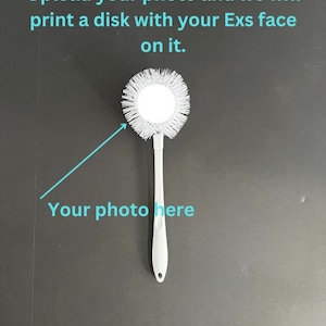May include: A white toilet bowl brush with a long handle and a round brush head. The text "Upload your photo and we will print a disk with your Exs face on it" is visible. The text "Your photo here" is also visible.