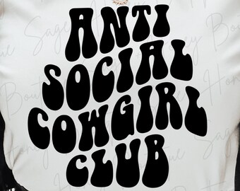 May include: White t-shirt with black text that reads "Anti Social Cowgirl Club" in a retro font.