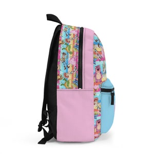 May include: A pink and blue backpack with a colorful pattern of Toy Story characters. The backpack has a zippered front pocket and adjustable straps.