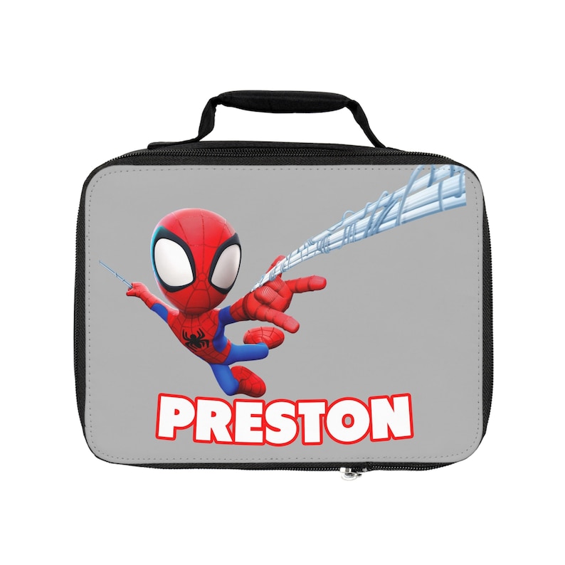 May include: A gray lunch bag with a black handle and zipper. The bag features a cartoon image of Spiderman swinging on a web, with the name "PRESTON" printed below the image.