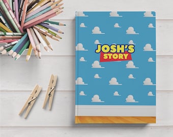 May include: A blue notebook with a white cloud pattern and the text "JOSH'S STORY" in red and yellow letters.