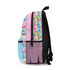 May include: A pink backpack with a colorful pattern of characters from the Toy Story franchise. The backpack has a mesh pocket on the side and a blue zippered pocket on the front.