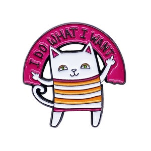 May include: White cat with orange and white stripes, giving the middle finger, with a pink circle around it that says "I do what I want".