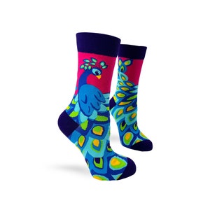 May include: A pair of colorful socks with a peacock design. The socks are pink, blue, green, and yellow. The peacock is blue with a green and yellow tail.