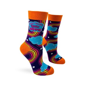 May include: A pair of colourful socks with a psychedelic rainbow pattern and clouds. The socks have an orange cuff and the text "Stay trippy little hippie" is printed on one sock.