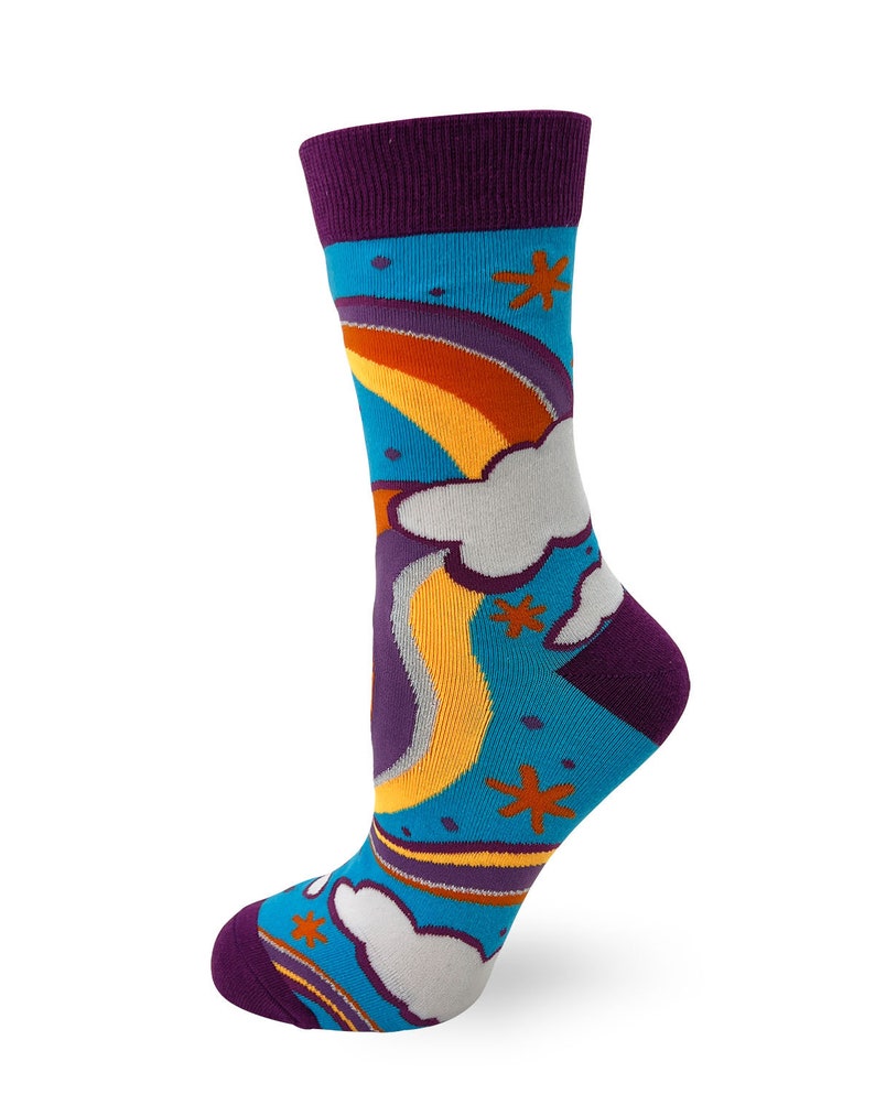 May include: A pair of colorful socks with a rainbow and clouds design. The socks are blue, purple, yellow, orange, and white.