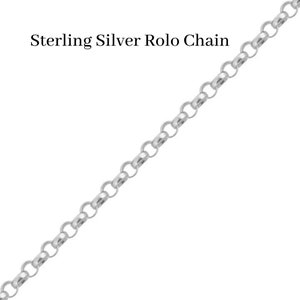 May include: Sterling Silver Rolo Chain. A close-up of a silver chain with a rolo design.