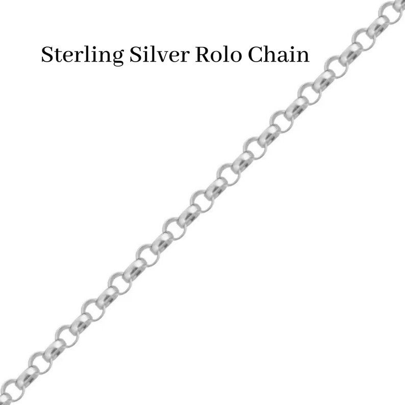 May include: Sterling Silver Rolo Chain. A close-up of a silver chain with a rolo design.